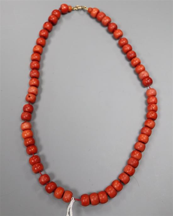 A single strand coral bead necklace, with GCS report indicating colour modification, 47cm, gross 64 grams.